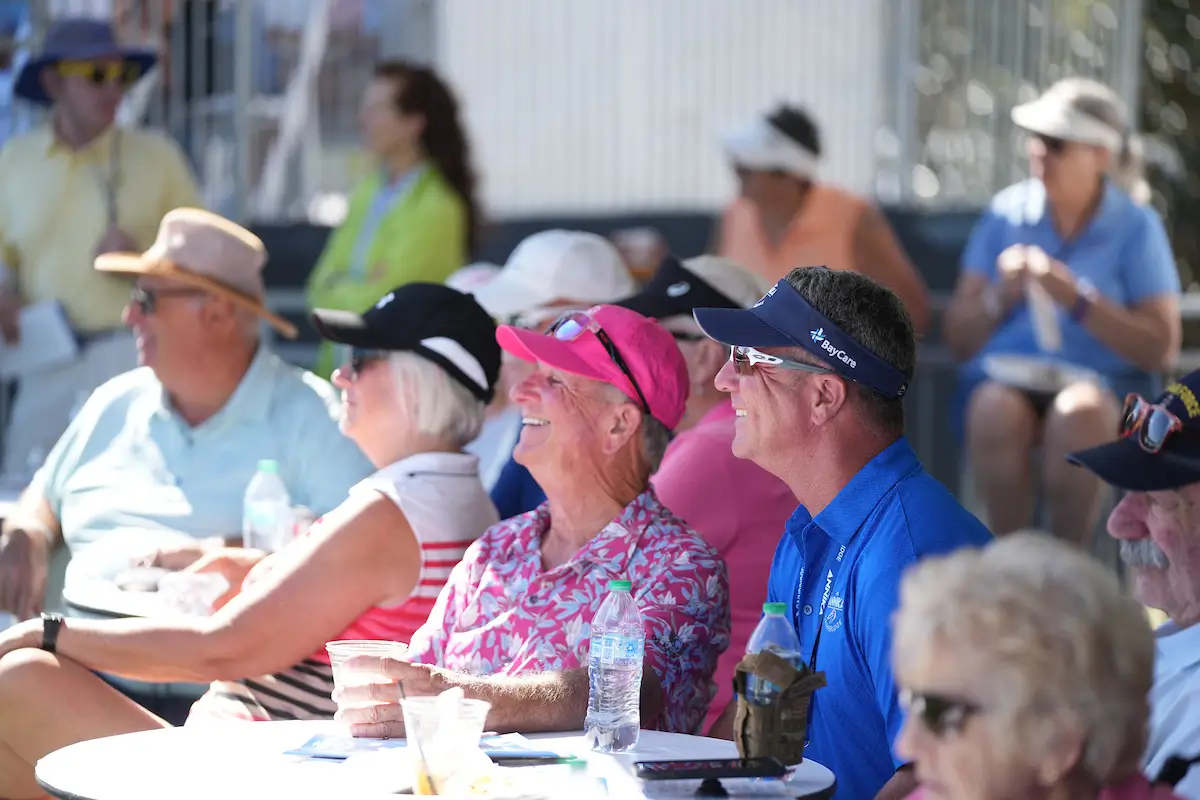 Men and Women watching golf