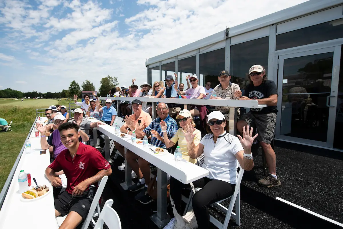 Fans waving to the camera