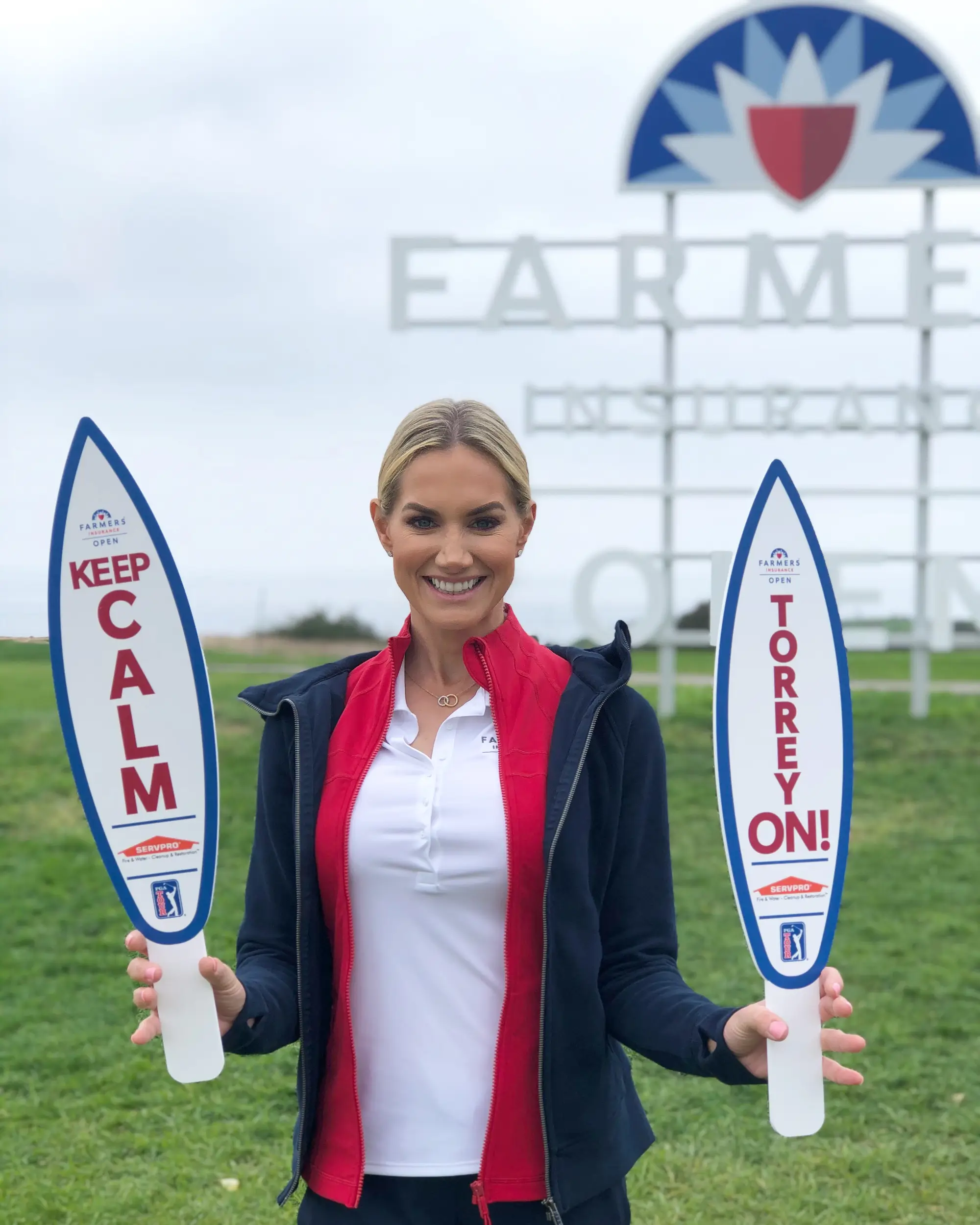 Blonde woman holding signs