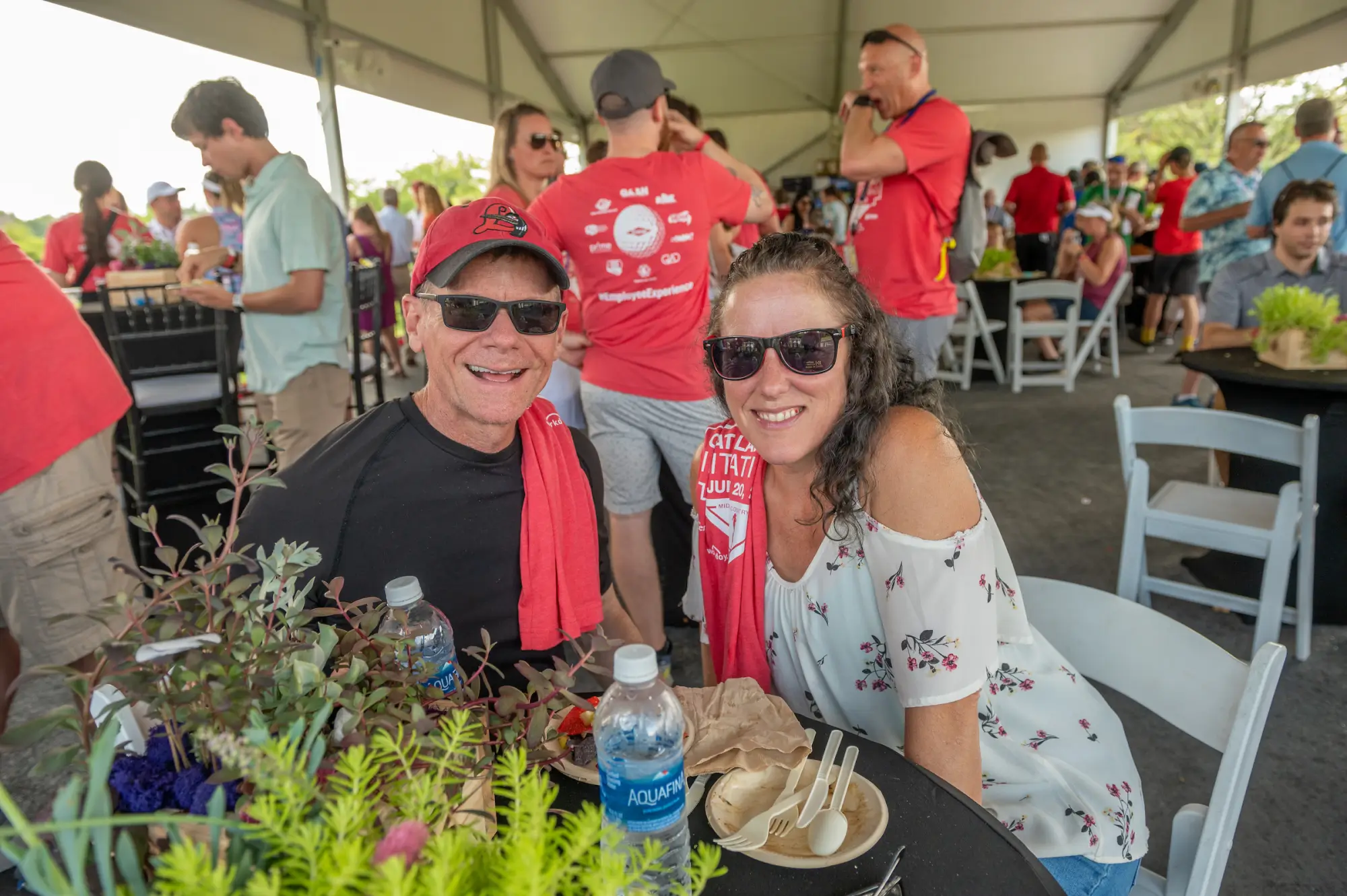 man and woman sitting down at Great Lakes Bay Invitational