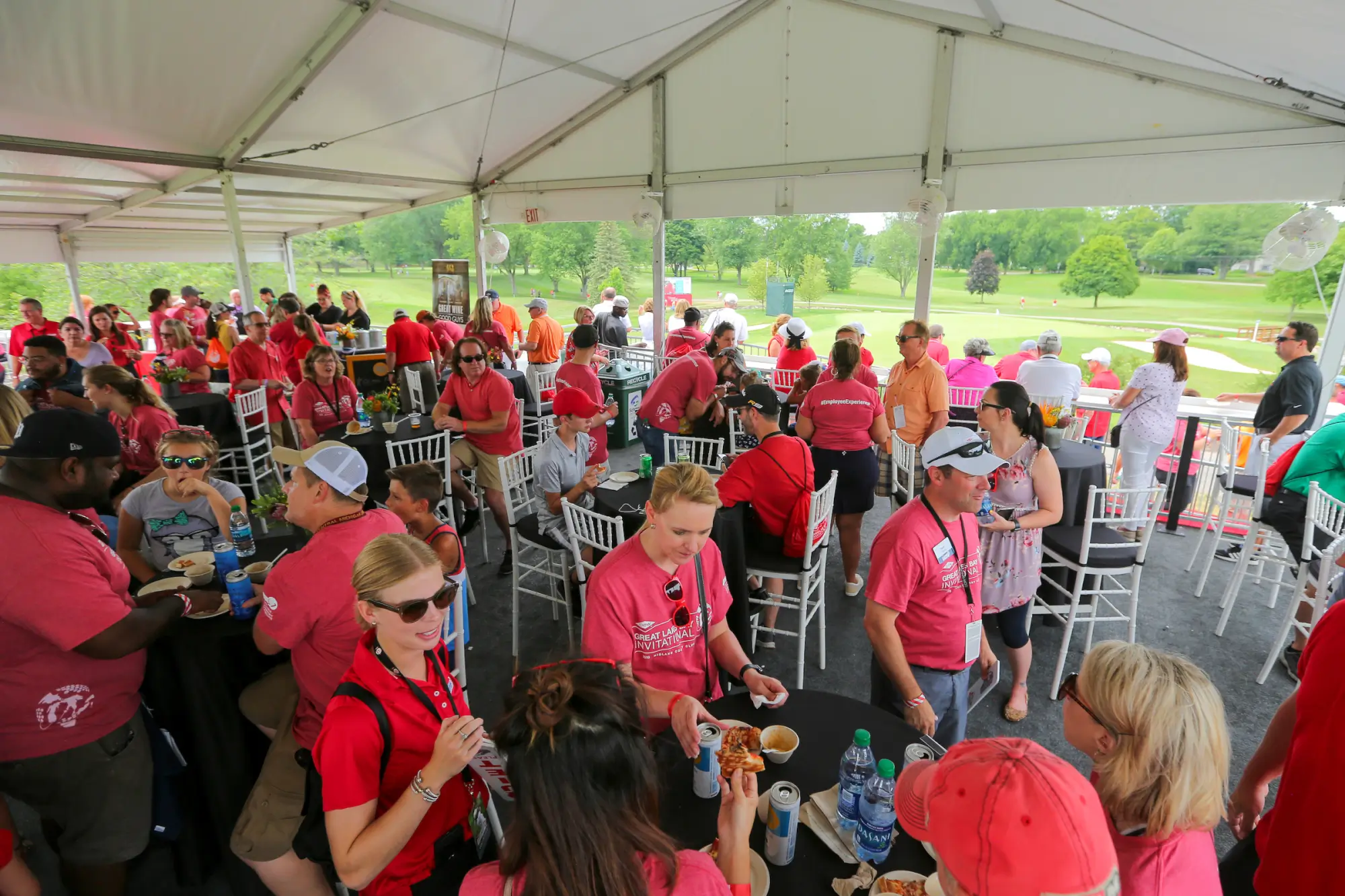 large group of people under a viewing tent at Great Lakes Bay Invitational